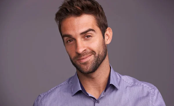 Rugged and manly. Studio shot of a handsome man against a gray background. — Stock Photo, Image