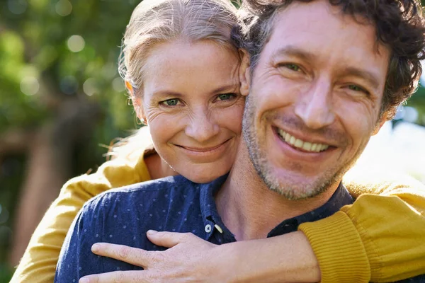 Love and dedication. Cropped shot of an affectionate husband and wife standing outdoors. — ストック写真