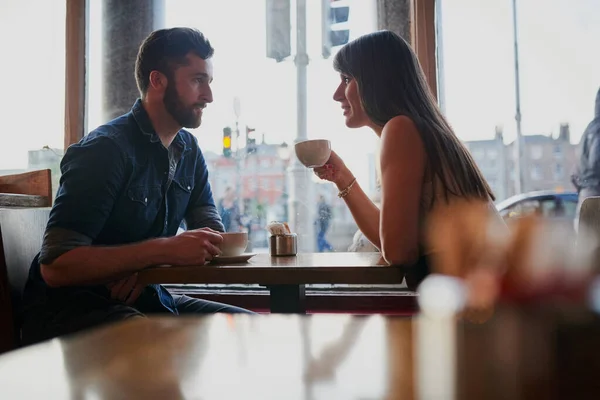 Reenacting their first date. Cropped shot of an affectionate young couple sitting in a coffee shop while on a date. — Stock Photo, Image