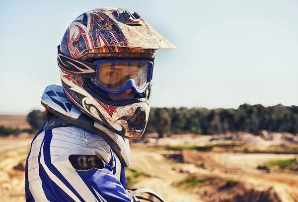 Time to rip up this track. Portrait of motocross rider looking back. — ストック写真
