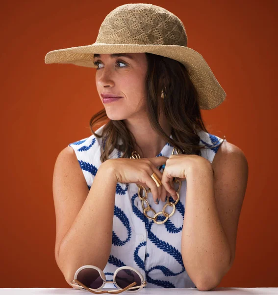 My style is an expression of who I am. Studio shot of a stylish young woman posing against a brown background. — Stock Photo, Image