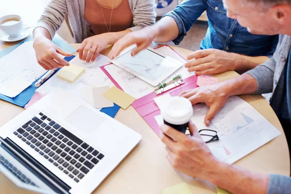 Rush of inspiration. Closeup shot of people using a tablet in a planning meeting. — Stock Photo, Image