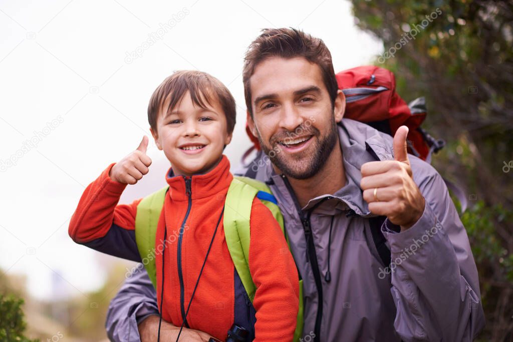This trail is great for all levels. Portrait of a father and son enjoying a hike together.