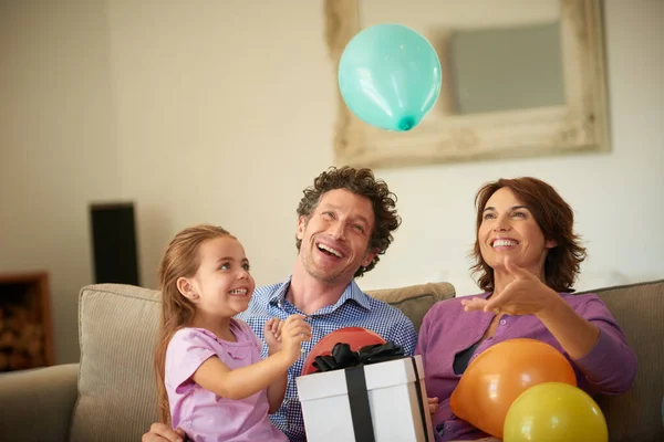 Best birthday ever. Shot of a happy little girl celebrating her birthday with her family. — Stock Photo, Image