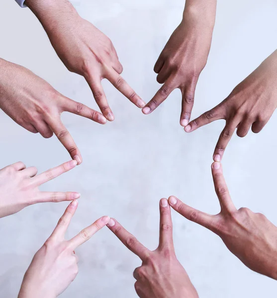 Stars still shine despite bad weather. Shot of a group of unrecognizable businesspeople making a star shape with their hands. — Stock Photo, Image