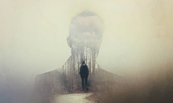 The soul seeks its own path. Composite image of a mans silhouette superimposed on a woman alone in the woods. — ストック写真