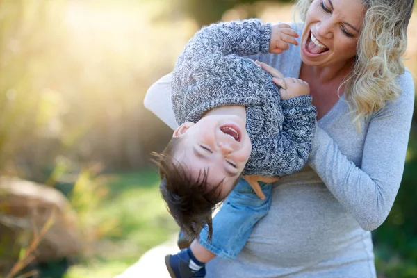 Having some fun with mommy. Cropped shot of a mother bonding with her little boy outside. — Photo