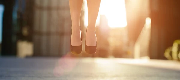 Business woman feet jumping concept series. Shot of a businesswoman jumping in the air. — Foto de Stock