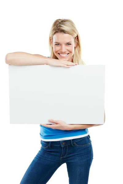 Allow me to introduce you to the future. Studio shot of an attractive young woman holding up a blank placard. — Stock Photo, Image