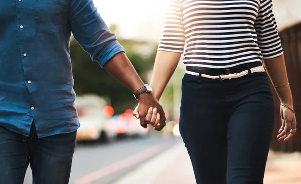 Love, never let it go. Cropped shot of an affectionate couple holding hands outdoors. — Foto de Stock