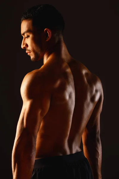 Lifes too short to be basic. Studio shot of a fit young man posing against a black background. — 스톡 사진