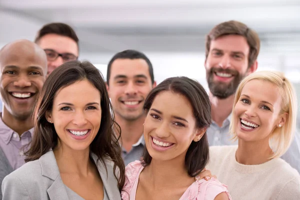 Success would put a smile on your face too. Cropped shot of a group of positive businesspeople. — стоковое фото