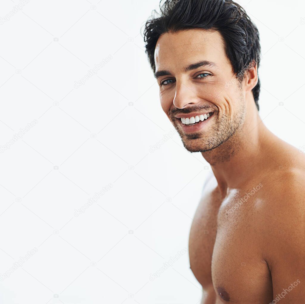 Eyes youll never forget. Shot of a man posing shirtless over a white background.