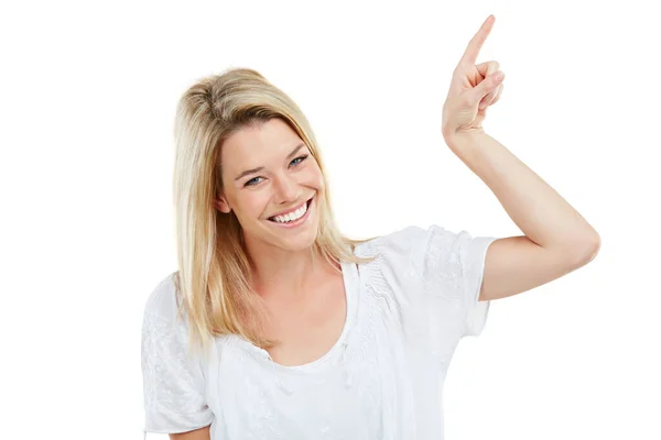 This has to make you as happy as I am. Studio portrait of an attractive young woman pointing at copyspace against a white background. — Stock Photo, Image