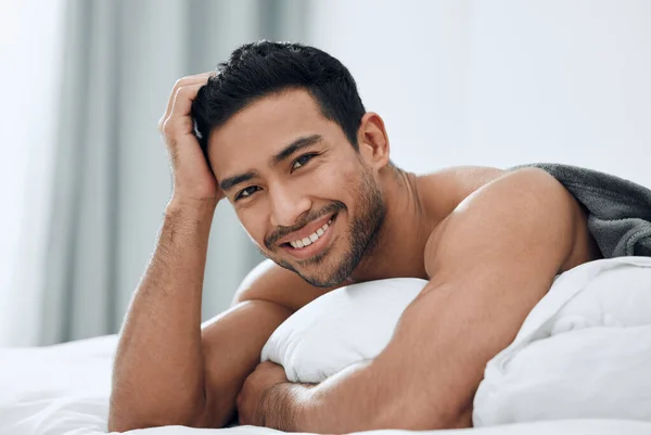 The bedroom is my happy place. Shot of a handsome young man lying on his bed. — Foto de Stock