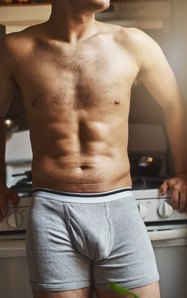 Some early morning contemplation. Cropped shot of an unrecignizable shirtless man in the kitchen at home. — Foto de Stock