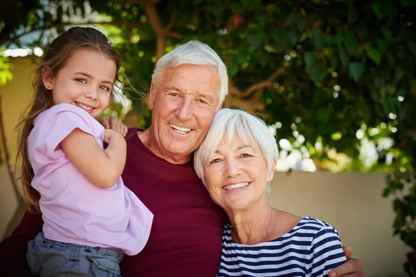 She is their treasure. Cropped portrait of a little girl spending time with her grandparents. — Stock Photo, Image