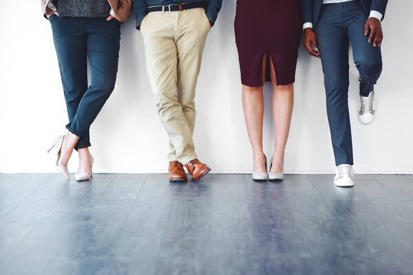 Its all in your body language. Cropped shot of a group of unrecognizable people standing against a white background.