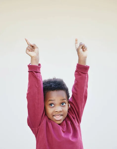 I have something for the kids. Shot of an adorable little boy standing against a white background. — 스톡 사진