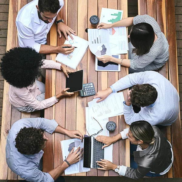 This is where we strategize, improvise and aim to succeed. High angle shot of a team of businesspeople having a meeting outside. —  Fotos de Stock