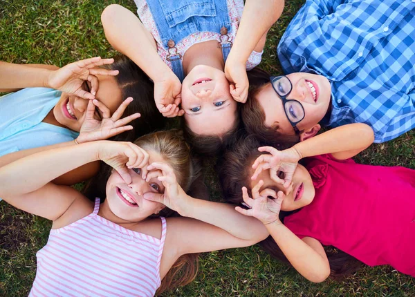 Children see magic because they look for it. Shot of a group of elementary school children together. — Stock Photo, Image