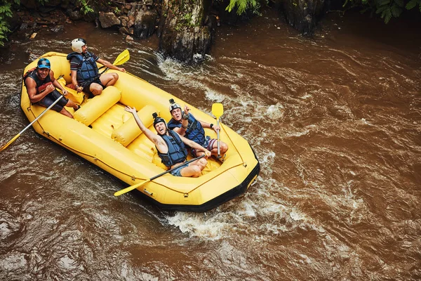 Life is either a daring adventure or nothing at all. Shot of a group of friends out river rafting on a sunny day. — 스톡 사진