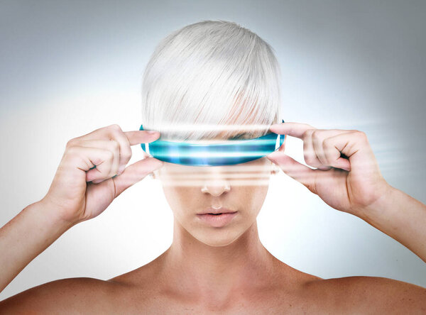 Envisioning the future. A futuristic view of a young woman with glasses.