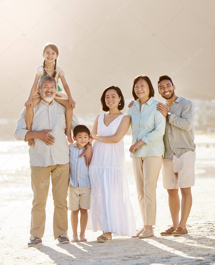 Always make time for your family. Full length shot of a happy diverse multi-generational family at the beach.