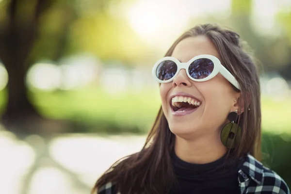 Freedom and laughter. Cropped shot of an attractive young woman spending the day outdoors. — ストック写真