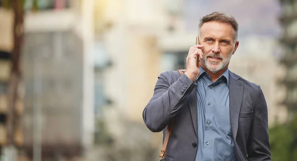There is no way that will work. Shot of a mature businessman using his smartphone to make a phone call. —  Fotos de Stock