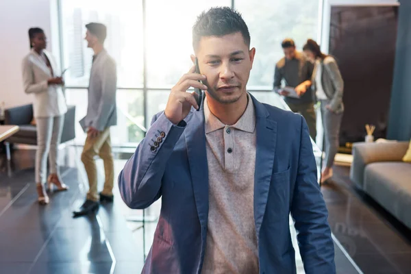 He never stops networking. Shot of a young businessman on a call at work. — 스톡 사진