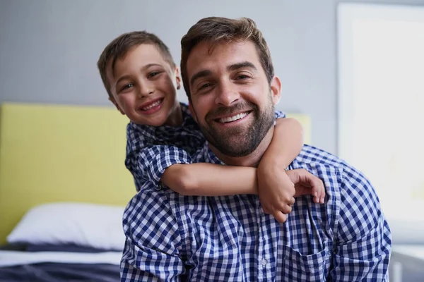 I wanna be just like my dad. Cropped portrait of a handsome young man and his son sitting in their home. — Stock Photo, Image