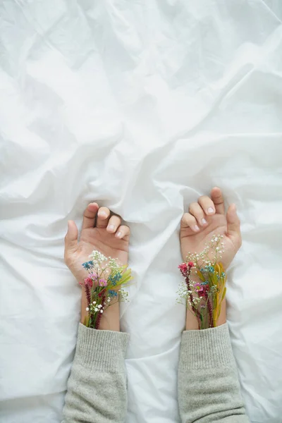 Sprouting flowers. Shot of plants growing from an unrecognizable persons sleeves placed next to each other. — 스톡 사진