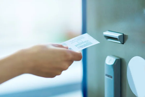 Paying for peace of mind. Cropped shot of an unrecognizable person inserting a ticket into a meter. — Stock Photo, Image