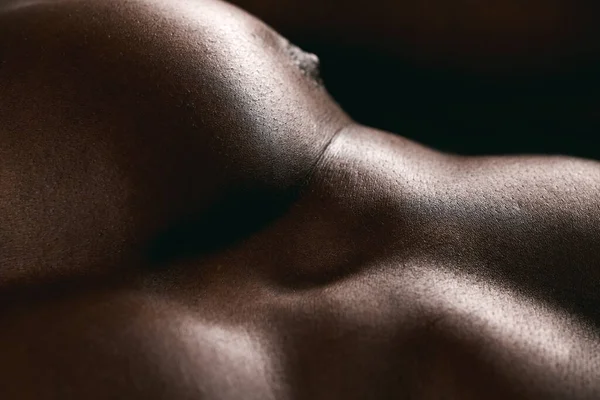 Rock hard and ripped. Shot of a muscular man posing against a studio background. —  Fotos de Stock