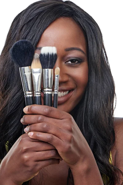My beauty tools. Studio shot of a young woman holding a makeup brush isolated on white. — ストック写真