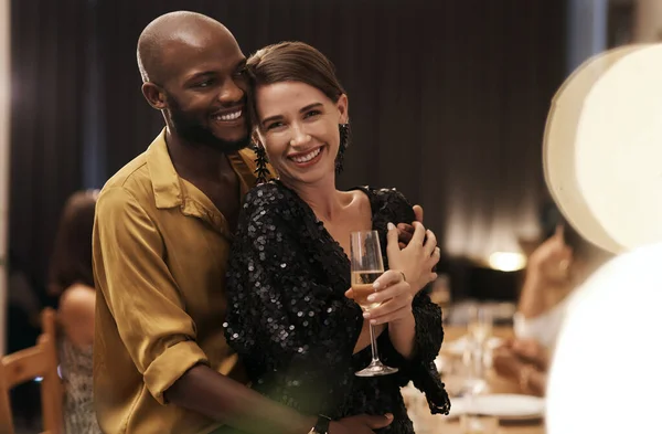 I found love this year. Shot of a happy young couple standing close together during a New Years eve dinner party. — Photo