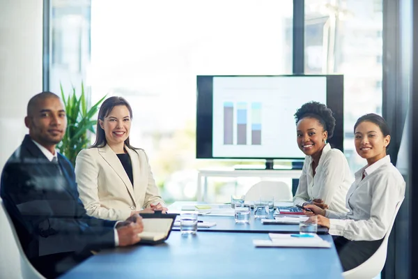 We know that hard work pays off in the end. Portrait of a group of businesspeople having a boardroom meeting together. — Stock Photo, Image