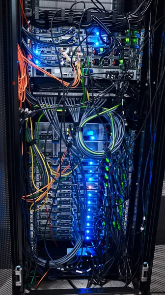 Complicated is an understatement. Cropped shot of the inside of a computer with all of its wiring located in a server room. — Stock Photo, Image