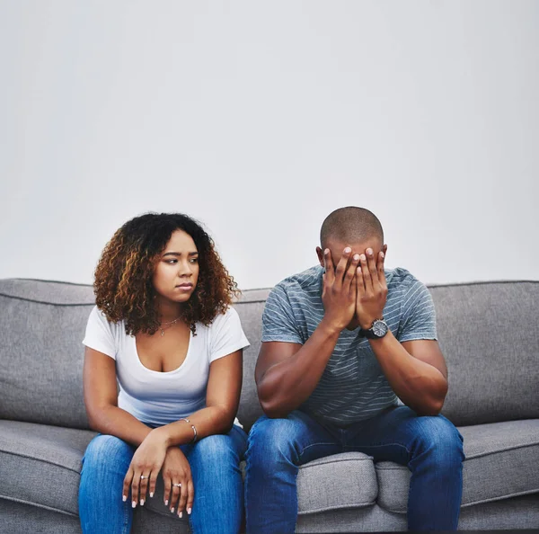Have the walls closed in on their relationship. Shot of a young couple having relationship problems at home. — Stock Photo, Image