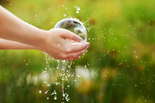 Conserving the environment is essential. Closeup shot of hands held out under a stream of water. — Stock Photo, Image