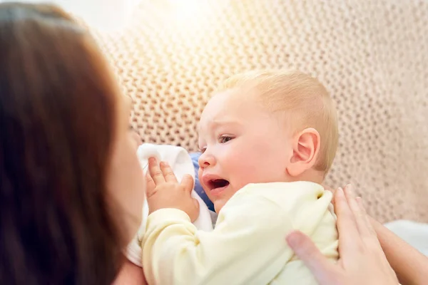 But I dont want to sleep now. Shot of a mother trying to put her baby to sleep. — Stock Photo, Image