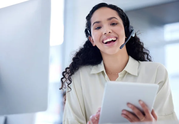 The device that helps me get things done quicker. Portrait of a young call centre agent using a digital tablet while working in an office. — Stock Photo, Image