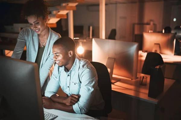 Getting some help. High angle shot of two young designers working together on a computer in their office. — Stock Photo, Image