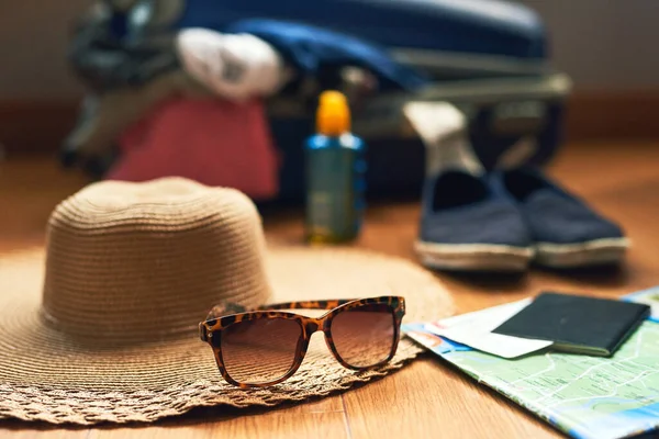 Lets head out on an adventure. Cropped shot of travelling essentials on a table. — Stock Photo, Image