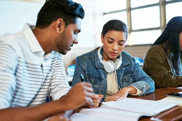 Doing it for our future. Cropped shot of two young university students working together in class. — Stock Photo, Image