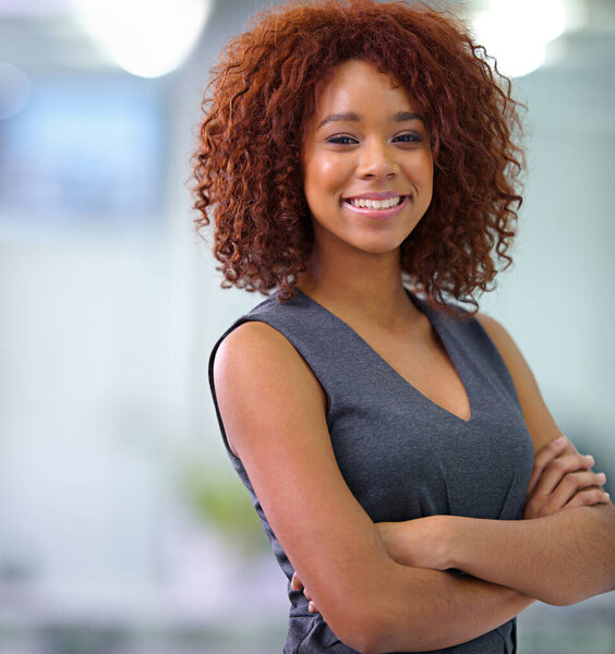 Brimming with self-confidence. Portrait of a young African American businesswoman smiling confidently at the camera.