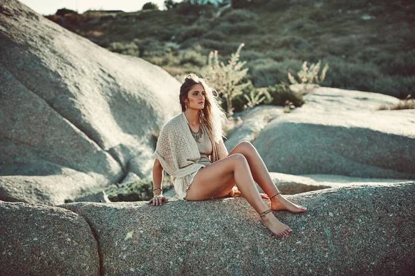 The perfect spot to enjoy the view. Shot of an attractive young woman spending a day at the beach. — Stock Photo, Image