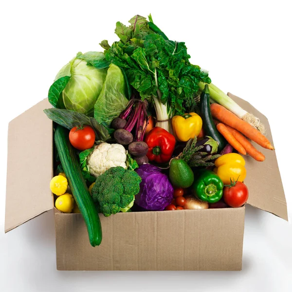 Get your box of organic goodness. Studio shot of a cardboard box filled with fruit and vegetables.