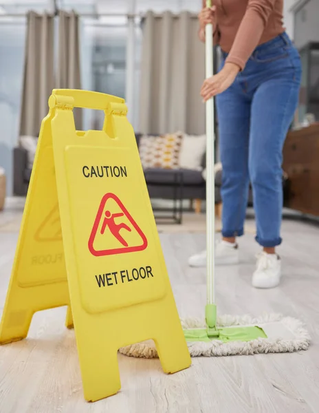 I want to see my reflection in the floors. Cropped shot of an unrecognizable woman mopping her living room floor at home. — Stock Photo, Image